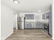 Modern kitchen featuring gray cabinets and stainless steel appliances at 4184 Knollwood Ct, Franklin, IN 46131