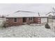 Brick ranch home with attached garage and snowy yard at 4208 E Epler E Ave, Indianapolis, IN 46237