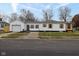 Newly renovated house with white siding, black accents, and a single-car garage at 5493 E 18Th St, Indianapolis, IN 46218