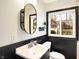 Updated bathroom features a window and stylish vanity at 5548 Carrollton Ave, Indianapolis, IN 46220