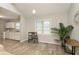 Bright dining area with kitchen view and wood floors at 5612 Hardegan St, Indianapolis, IN 46227