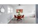 Cozy dining area with round glass table and red chairs at 5638 Dunk Dr, Indianapolis, IN 46224