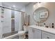 Modern bathroom with marble shower and updated vanity at 5645 E 16Th St, Indianapolis, IN 46218