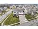 Two-story home situated on a tree-lined street in a residential neighborhood at 7648 Three Arch Overlook, Noblesville, IN 46062