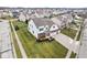 Aerial view of two-story house with large driveway and yard at 7648 Three Arch Overlook, Noblesville, IN 46062