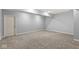 Finished basement room with neutral walls and carpeting at 7648 Three Arch Overlook, Noblesville, IN 46062