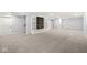 Finished basement with built-in shelving and carpet at 7648 Three Arch Overlook, Noblesville, IN 46062