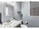 Modern bathroom with single sink vanity and toilet at 7648 Three Arch Overlook, Noblesville, IN 46062
