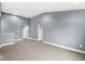 Spacious bonus room with gray walls and carpet flooring at 7648 Three Arch Overlook, Noblesville, IN 46062