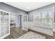 Bright home office with hardwood floors, wainscoting, and large windows at 7648 Three Arch Overlook, Noblesville, IN 46062