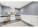 Functional home office with built-in shelving, a desk, and comfortable seating at 7648 Three Arch Overlook, Noblesville, IN 46062