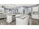Spacious kitchen with large island, granite countertops, and stainless steel appliances at 7648 Three Arch Overlook, Noblesville, IN 46062