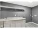Laundry room with white cabinets and granite countertop at 7648 Three Arch Overlook, Noblesville, IN 46062