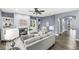 Cozy living room features hardwood floors, a fireplace, and built-in shelving at 7648 Three Arch Overlook, Noblesville, IN 46062