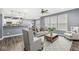Relaxing living room with hardwood floors and ample natural light at 7648 Three Arch Overlook, Noblesville, IN 46062
