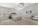 Main bedroom with ceiling fan and sitting area at 7648 Three Arch Overlook, Noblesville, IN 46062