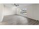 Spacious living room featuring laminate flooring and lots of natural light at 819 S Taft Ave, Indianapolis, IN 46241