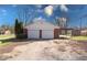 Two-car brick garage with additional covered storage at 9155 Melrose Ct, Indianapolis, IN 46239