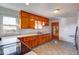 Kitchen with wood cabinets and a neutral color scheme at 9155 Melrose Ct, Indianapolis, IN 46239