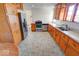 Kitchen with stainless steel appliances and wood cabinets at 9155 Melrose Ct, Indianapolis, IN 46239