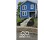 Two-story blue house with landscaped yard and walkway at 1014 W 26Th St, Indianapolis, IN 46208