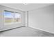 Bright bedroom featuring a large window and grey carpet at 16222 Browning Ct, Fishers, IN 46037