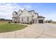 Two-story home showcasing a side view of the garage and driveway at 16222 Browning Ct, Fishers, IN 46037