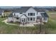 Two-story house with a large backyard, patio, hot tub, and pergola at 16222 Browning Ct, Fishers, IN 46037