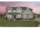 Two-story house with a landscaped yard at sunset at 16222 Browning Ct, Fishers, IN 46037