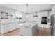 Eat-in kitchen with island, granite countertops, and white cabinets at 16222 Browning Ct, Fishers, IN 46037