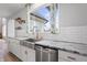 Kitchen features a farmhouse sink and granite counters at 16222 Browning Ct, Fishers, IN 46037