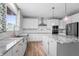 Modern kitchen with white cabinets and granite countertops at 16222 Browning Ct, Fishers, IN 46037