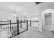 Upstairs hall with carpeting and views to the lower level at 16222 Browning Ct, Fishers, IN 46037