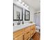 Bathroom with double vanity and large mirrors at 1705 Blue Grass Pkwy, Greenwood, IN 46143