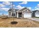 New construction home with landscaping and a two-car garage at 19689 Highclere Ln, Westfield, IN 46069