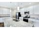 Modern kitchen with granite island and stainless steel appliances at 19689 Highclere Ln, Westfield, IN 46069