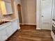 Modern kitchen with white cabinets and vinyl flooring at 2019 S Shipley St, Muncie, IN 47302