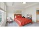 Mid-century modern bedroom with orange bedding and large windows at 3266 Morab Dr, Zionsville, IN 46077