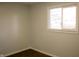 Small bedroom with one window and dark brown flooring at 34 Crestview Dr, Greenwood, IN 46143