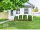 Small white house with a green lawn and shrubs at 356 S Lasalle St, Indianapolis, IN 46201