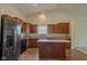 Modern kitchen with wood cabinets and an island at 4845 Ventura Blvd, Plainfield, IN 46168