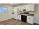 Newly remodeled kitchen with white cabinets and vinyl floors at 5140 W 34Th St, Indianapolis, IN 46224