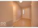 Tiled entryway with neutral walls and a coat closet at 5227 Lakemanor Dr, Indianapolis, IN 46254