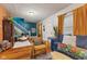 Bright and airy living room with hardwood floors and eclectic decor at 533 N Parker Ave, Indianapolis, IN 46201