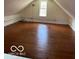 Large attic space with dark stained wood floors at 5967 S Lick Creek Rd, Morgantown, IN 46160