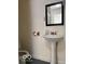 Small bathroom with pedestal sink and toilet at 5967 S Lick Creek Rd, Morgantown, IN 46160