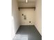 Laundry area with grey flooring and overhead shelving at 5967 S Lick Creek Rd, Morgantown, IN 46160