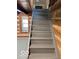 Gray painted stairs leading to the upper level at 5967 S Lick Creek Rd, Morgantown, IN 46160