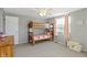 Bedroom with bunk beds, window, and ceiling fan at 6018 Thrushwood Dr, Indianapolis, IN 46250