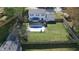 Backyard features a large grassy area and an inground pool at 6031 S Eaton Ave, Indianapolis, IN 46259